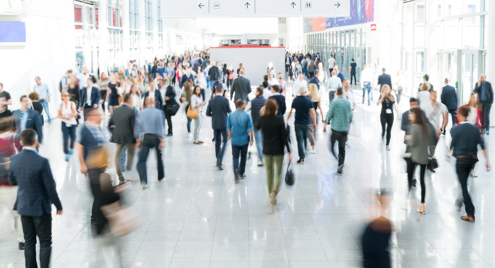 Crowd of attendees walking through a modern exhibition hall at POWTECH TECHNOPHARM 2025, showcasing processing technology innovations.